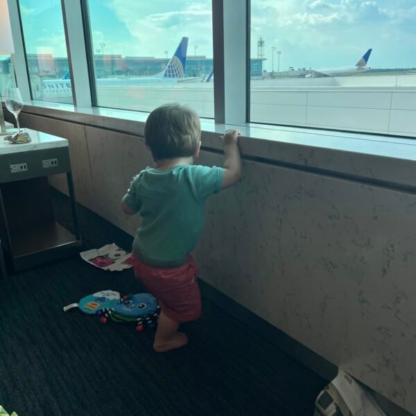 Child playing at window.